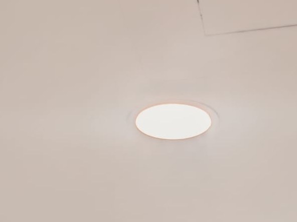New ceiling light installed in a white ceiling