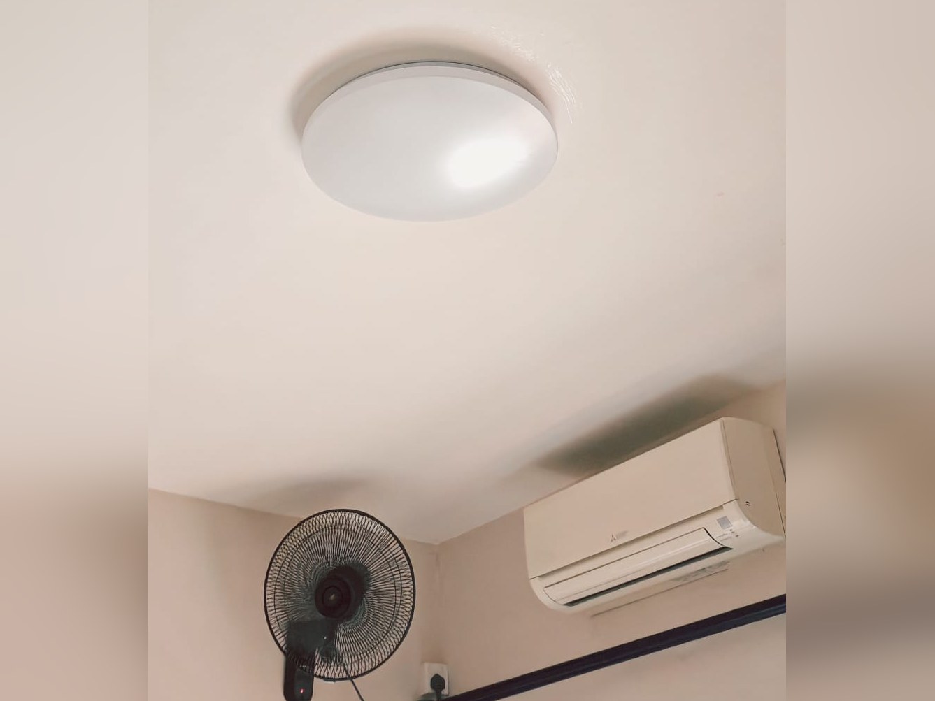 Ceiling light, wall fan and aircon fitted by our handyman team
