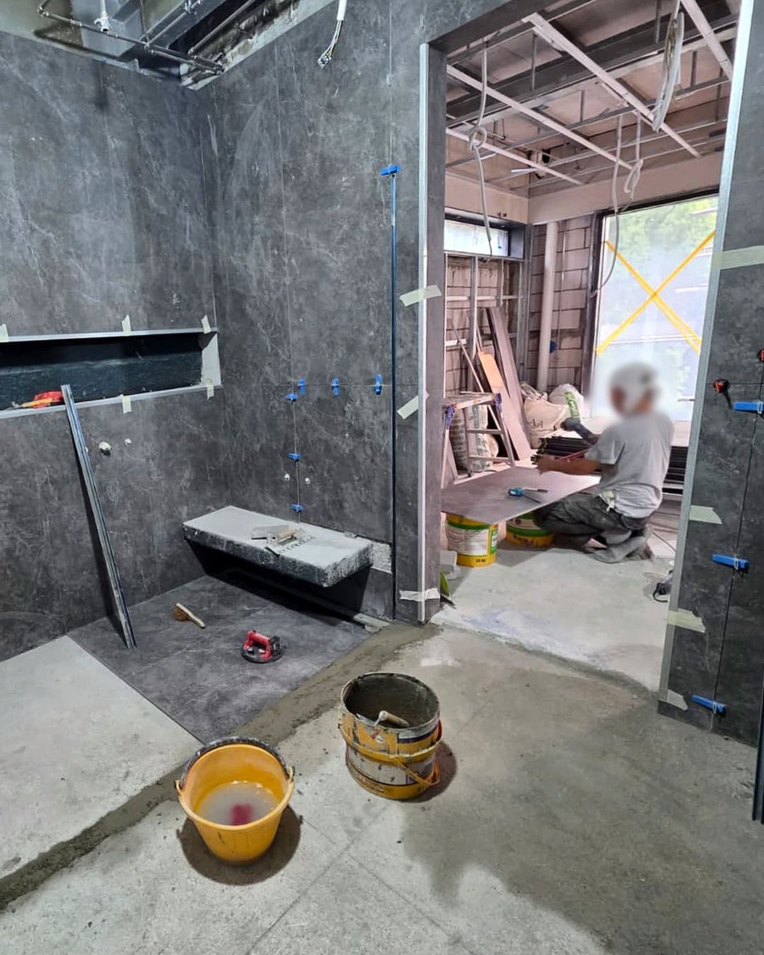 Bathroom renovation in progress – wall and floor tiling, Kakatua project