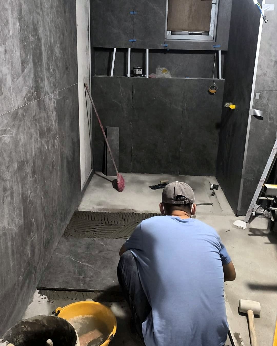 Renovation work – floor tiling bathroom