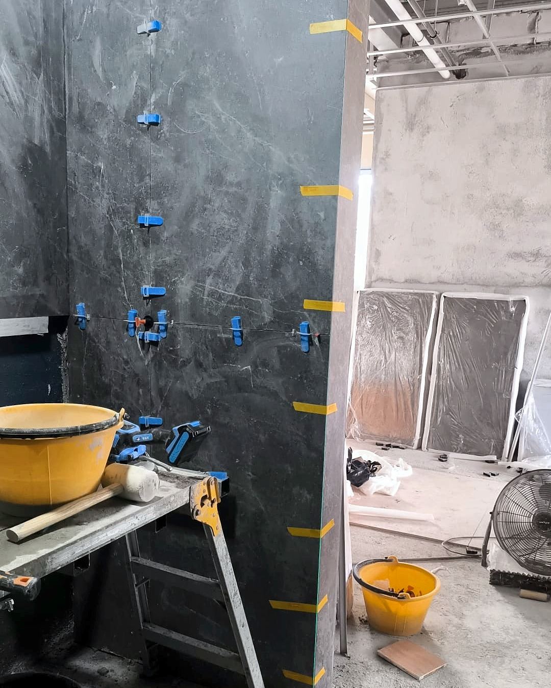 Wall tiling during a bathroom renovation
