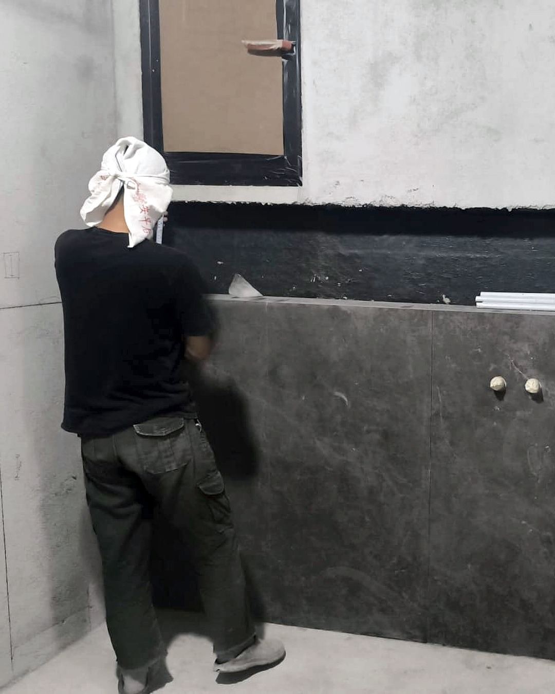 Our team setting out wall tiles on site