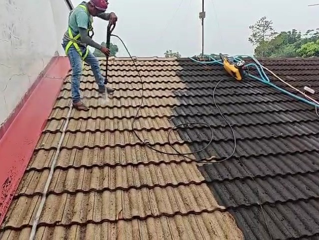 Roof preparation with pressure washer and safety harness