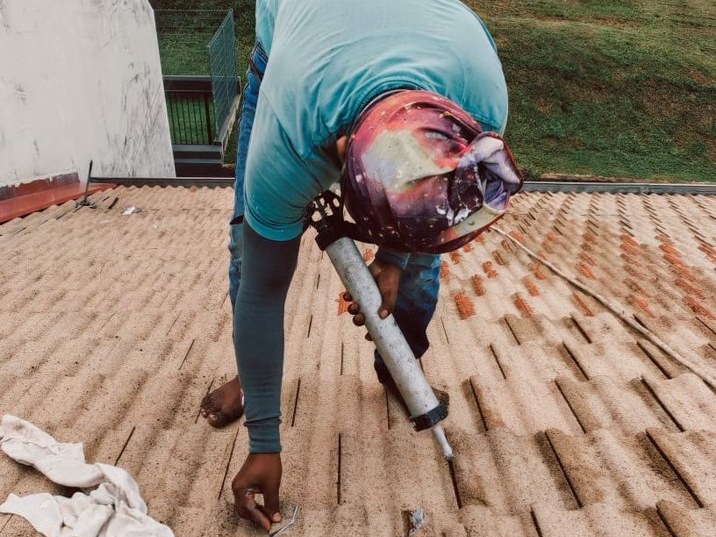 Roof tiles being sealed and coated for waterproofing