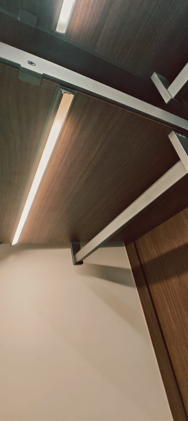 Custom wardrobe with LED cove lighting and hanging rod